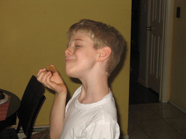 Nathaniel with cinnamon chip maple oat cookie