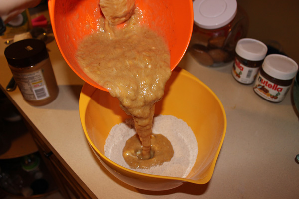 pouring batter into dry ingredients