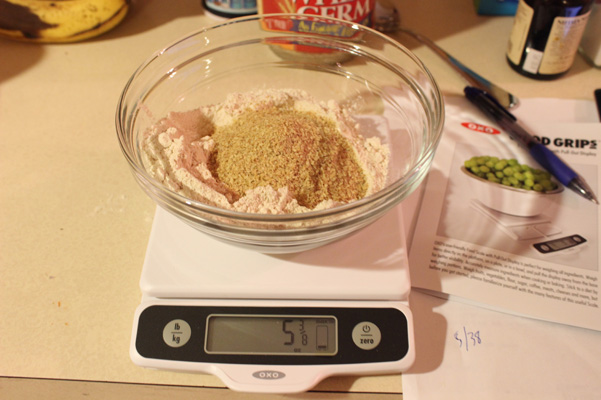 weighing flour and wheat germ