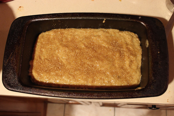 batter in pan with sugar on top