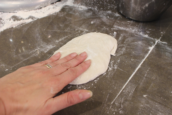 my hand on baguette dough
