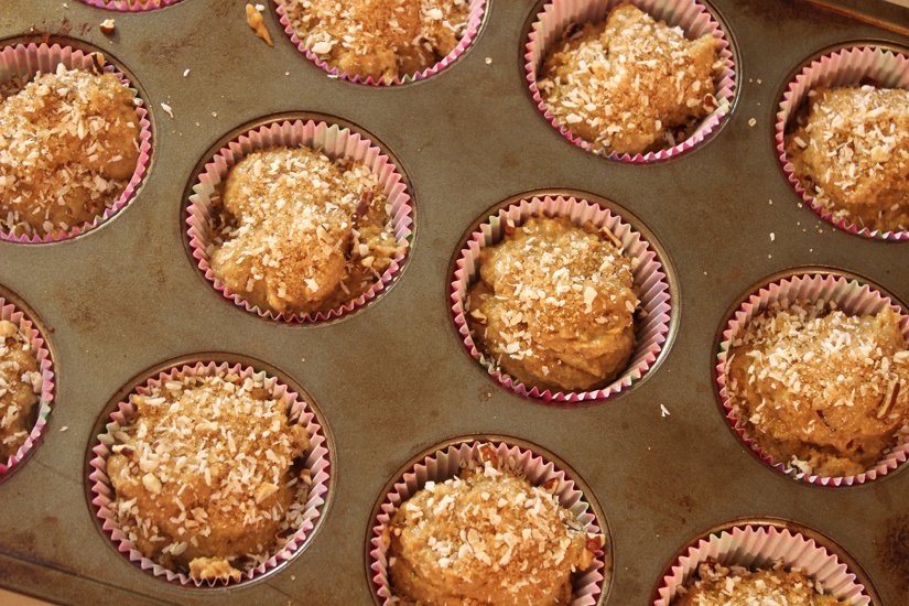vanilla crunch muffins in tin with topping